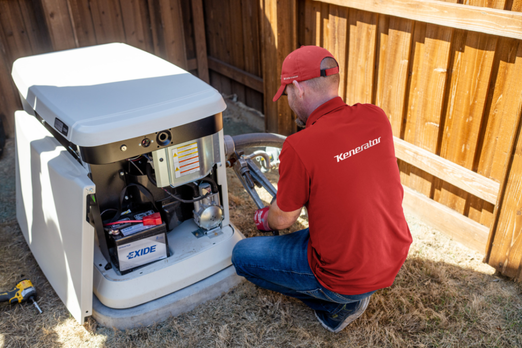 A Kenerator technician installing a generator